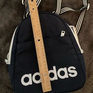 New, never used.Adidas back pack. Navy blue. Small.